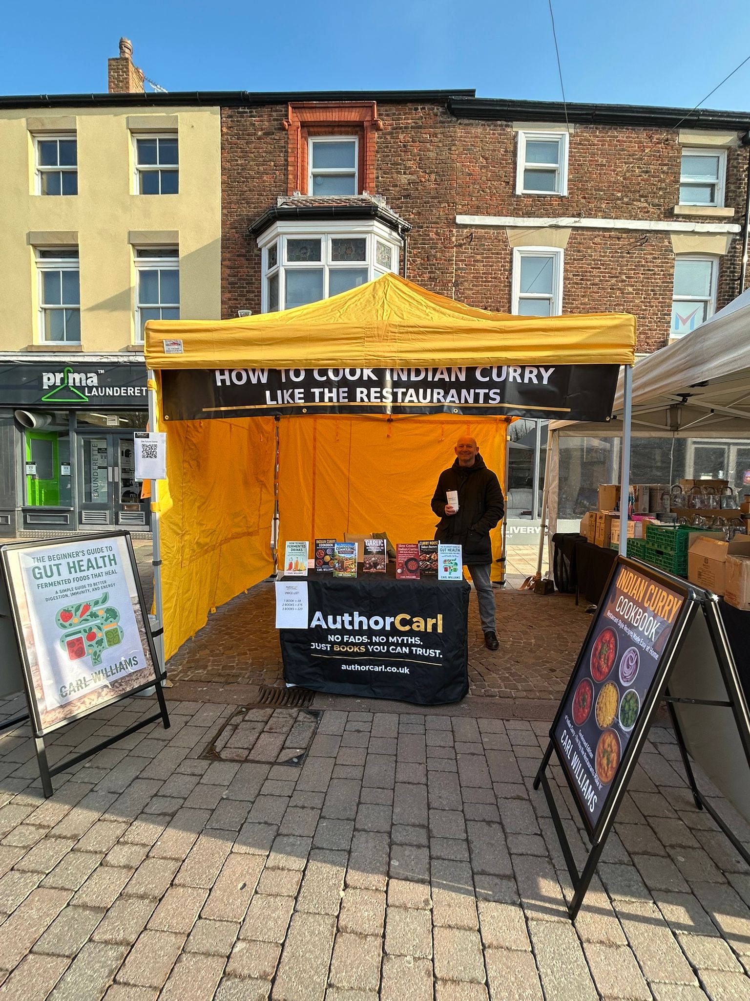 Author Carl stood at stall at Ormskirk Market in west Lancashire