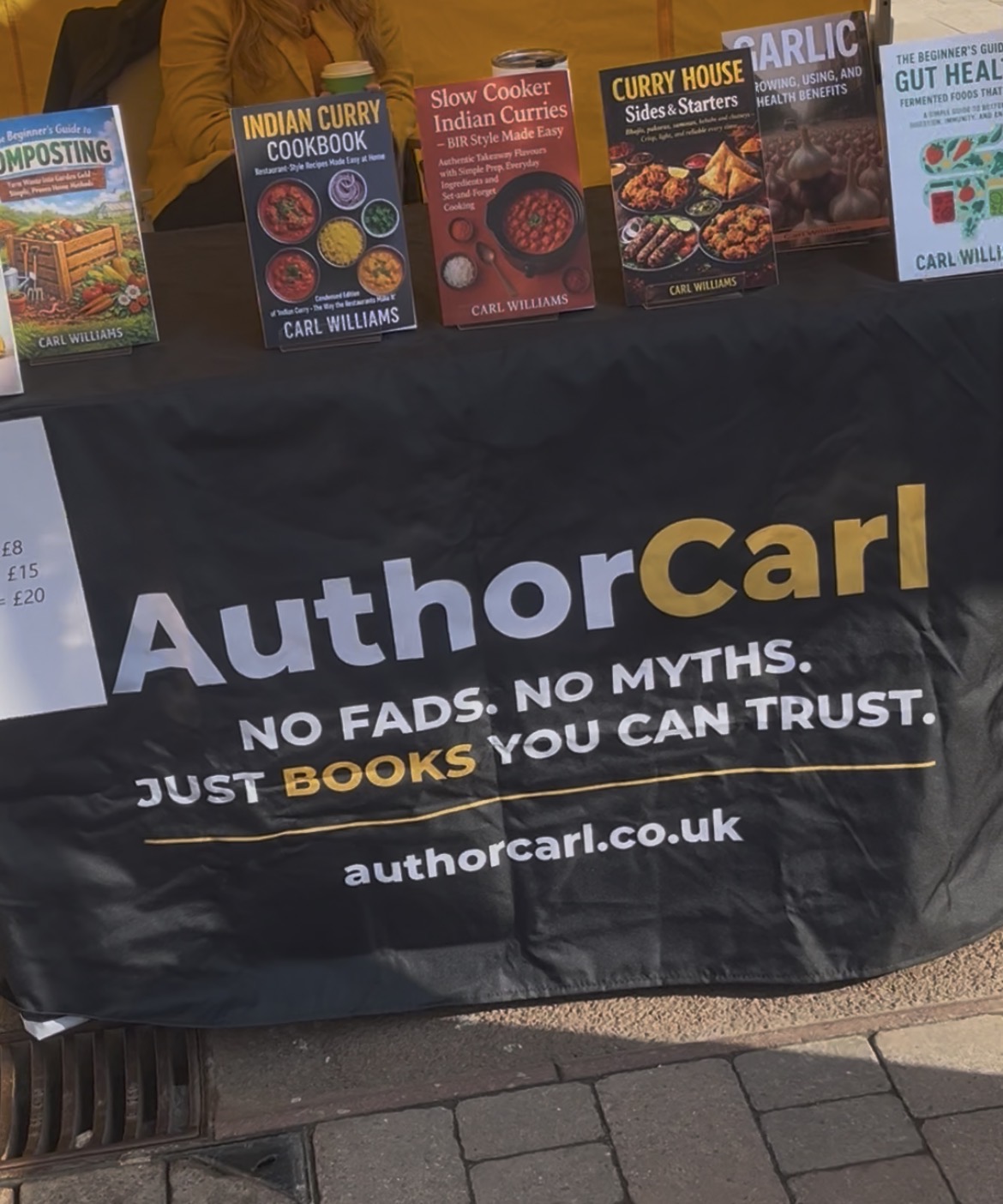 Author Carl books displayed on a market table at Ormskirk Market